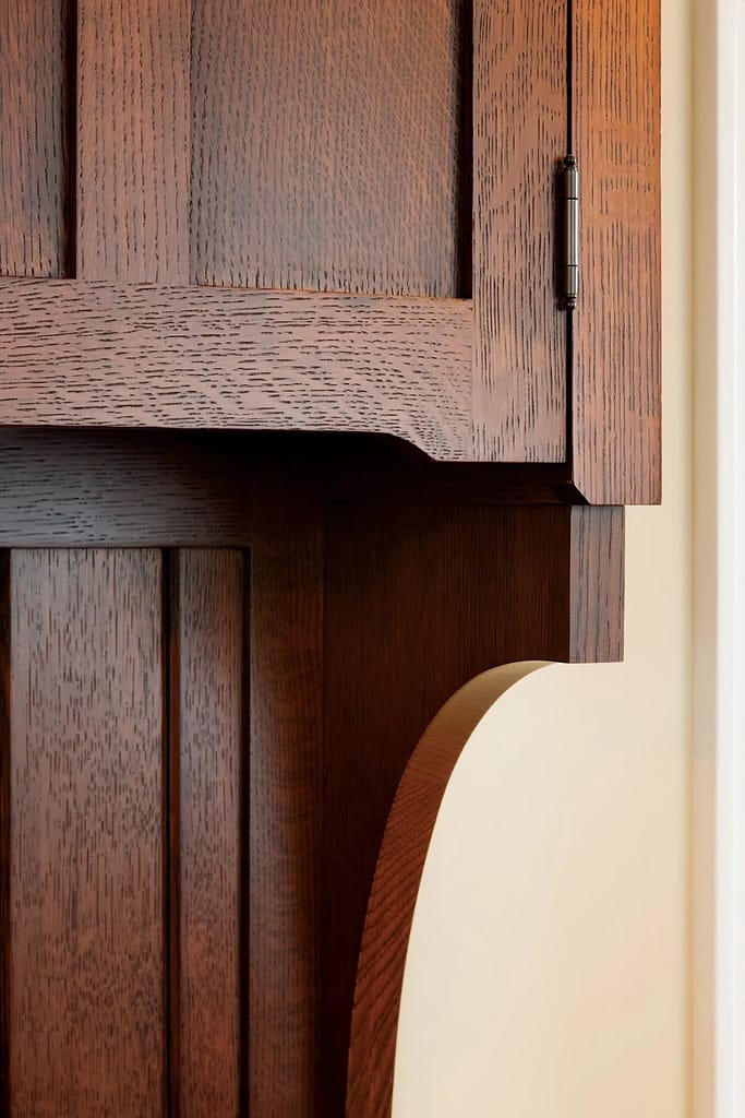 Detail showing close up of kitchen cabinet with oak grain showing