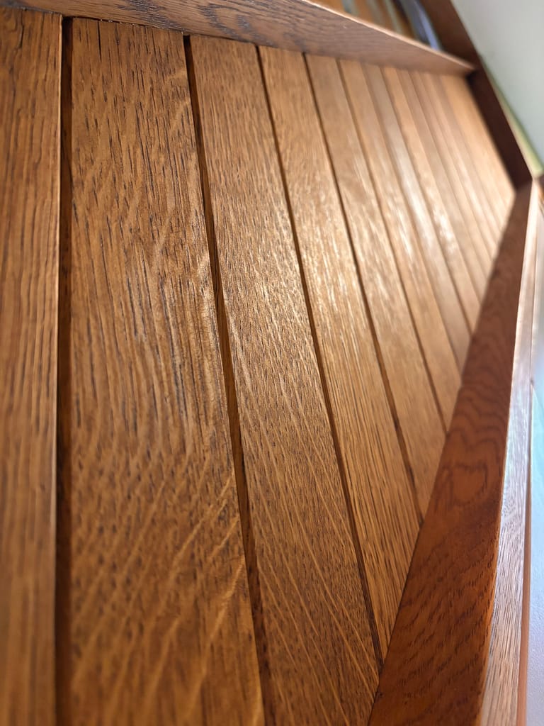 Solid oak quarter sawn panels on a bespoke staircase stringer